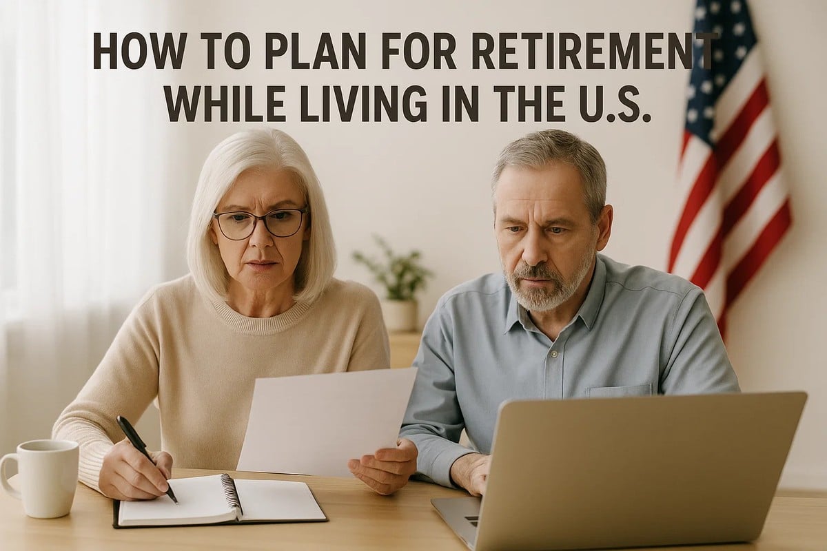 A senior woman with white hair and glasses is sitting at a wooden table, holding a piece of paper while writing notes in a notebook. Beside her, a senior man with gray hair looks intently at a laptop screen. An American flag is visible in the background, and natural light comes from a window on the left. A white mug sits on the table, enhancing the cozy and serious atmosphere of financial planning.